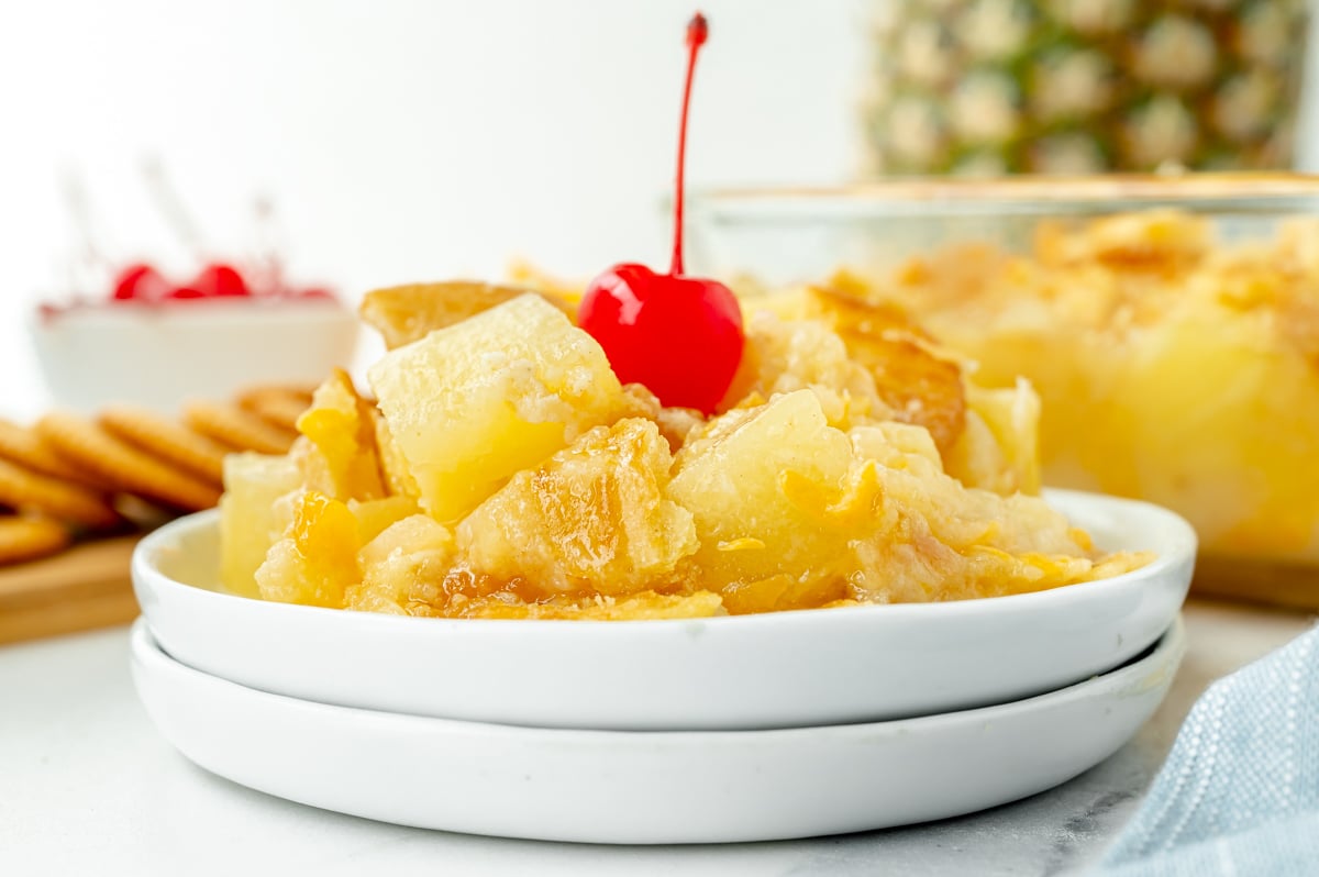 head-on image of southern pineapple casserole on white plates