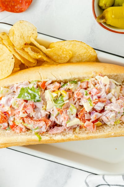 italian grinder sandwich on toasted roll served with chips